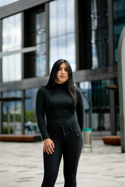 woman in all black; long sleeve and jeans